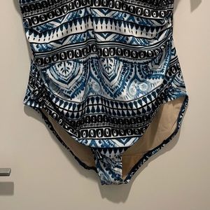 Never been worn but, tried on. Great quality. Tie closure behind neck only.